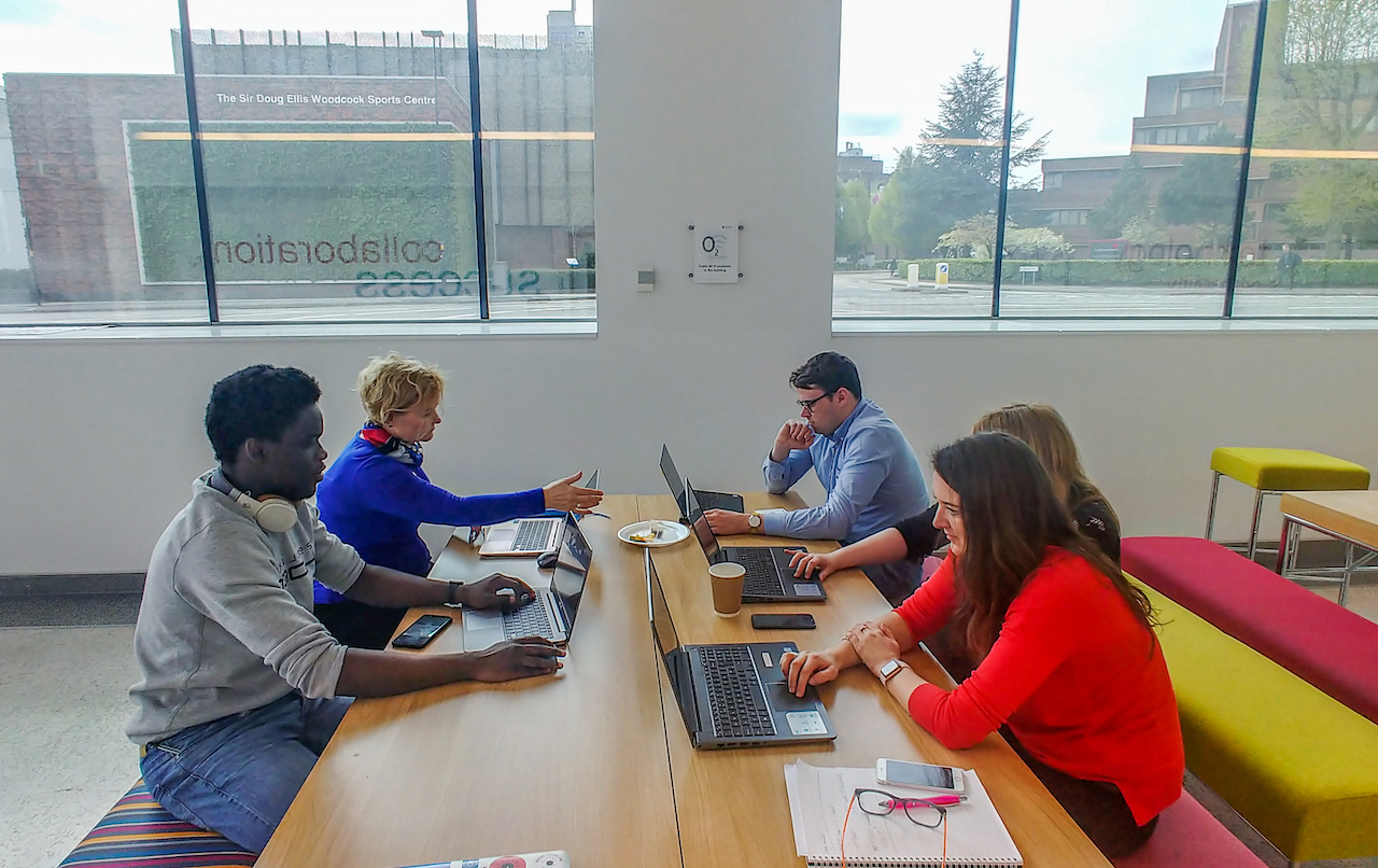 Birmingham data expedition: people sat around a desk with laptops.