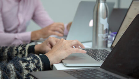 Hands on a laptop