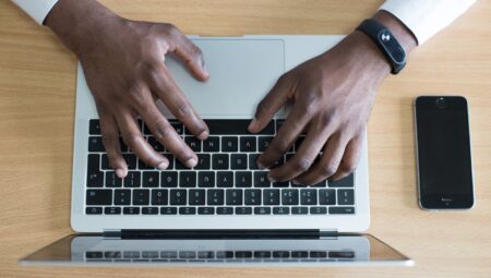 Man's hands on a laptop